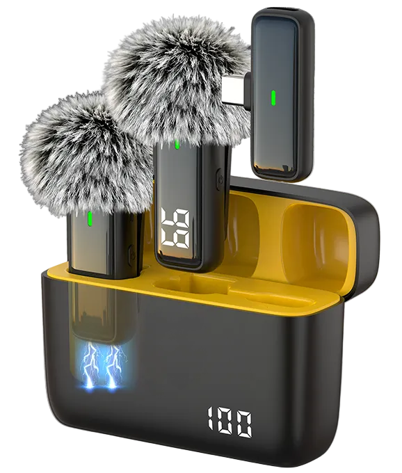 A wireless microphone system with two black microphones topped with gray furry windshields, resting in a black and yellow charging case with a digital battery display showing 100% and blue lightning graphics.